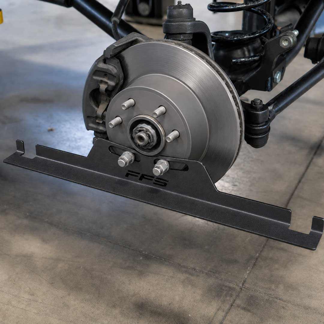 A close-up of a Toe Alignment Tool in use from Far From Stock Co..